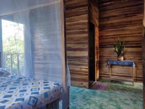 Postel nebo postele na pokoji v ubytování Hostal Corazón de Tagua