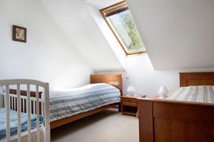Säng eller sängar i ett rum på Gostišče - Guest house STARI HRAST