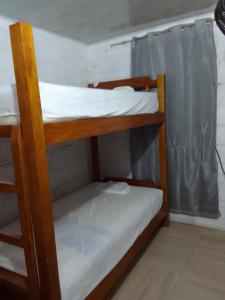 a couple of bunk beds in a room at Apart Cabaña KTIK in San Bernardo del Viento +22 photos