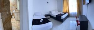 Postel nebo postele na pokoji v ubytování HOTEL EMBASSY STAR + 9 fotografií
