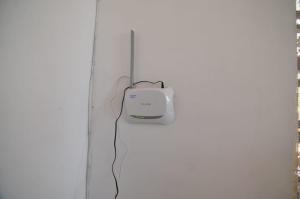 a computer monitor is hanging on a wall at SYDNEY HOMESTAY in Hikkaduwa