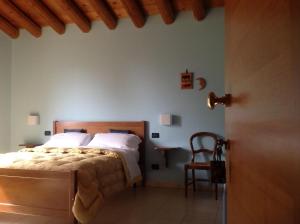 Ένα ή περισσότερα κρεβάτια σε δωμάτιο στο Agriturismo Altobello