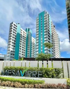 a group of tall buildings in a city at mesavirre garden residences in Bacolod