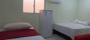 Postel nebo postele na pokoji v ubytování Double Room Near Airport in Santo Domingo Este