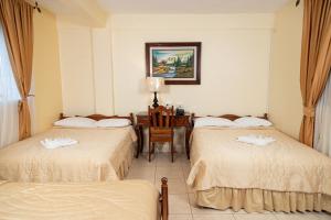 Letto o letti in una camera di Hotel Internacional Palmerola