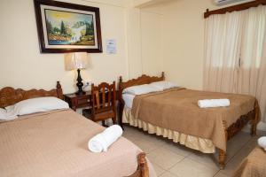 Letto o letti in una camera di Hotel Internacional Palmerola