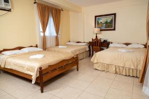 Letto o letti in una camera di Hotel Internacional Palmerola