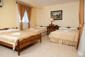 Letto o letti in una camera di Hotel Internacional Palmerola