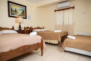 Letto o letti in una camera di Hotel Internacional Palmerola