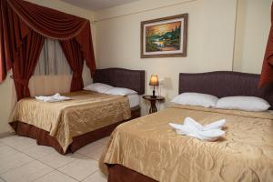 Letto o letti in una camera di Hotel Internacional Palmerola