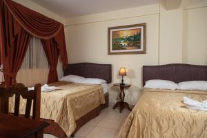Letto o letti in una camera di Hotel Internacional Palmerola