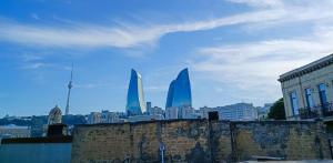 a view of a city with skyscrapers in the background at Sultan Inn Boutique Hotel in Baku