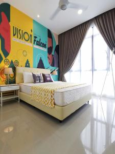 a bedroom with a yellow bed and a colorful wall at D'Pristine by Iconic Bliss in Nusajaya