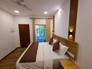 Postel nebo postele na pokoji v ubytování Kihaa Holiday Home + 12 fotografií