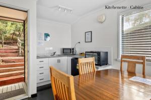 A kitchen or kitchenette at Hamptons on the Bay