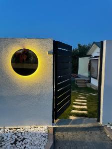 an open door with a window on a white wall at Minihane Sapanca in Sapanca