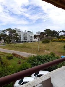 a group of cars parked on the side of a road at MAR DEL ESTE III PUNTA DEL ESTE in Punta del Este