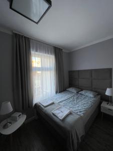 Posteľ alebo postele v izbe v ubytovaní CIENISTA 7 APARTMENTS