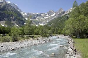 a river in a valley with mountains in the background at Apartamento Carlos Bielsa in Bielsa