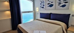 A bed or beds in a room at Casa Pomonte