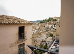 a view of a city from a balcony of a building at Casa Frasquita in Cehegín