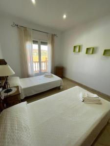 A bed or beds in a room at Casa Gonzalez