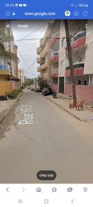 a screenshot of an empty street with a street view at Chez Ouly in Dakar