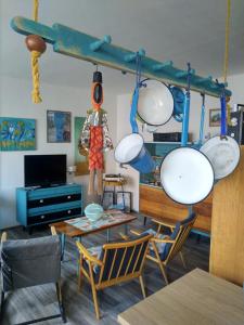 a room with a table and some pots and pans at Retro Art room in Lomnice nad Popelkou