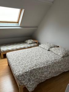 a bedroom with a bed and a window at Magnolia58 in Pontault-Combault