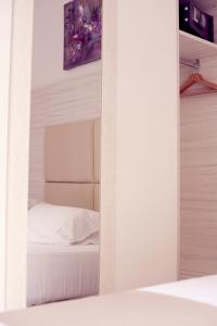 Postel nebo postele na pokoji v ubytování Hotel Fioralba