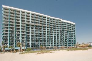 a large hotel on the beach next to the beach at Landmark Resort 1208 in Myrtle Beach