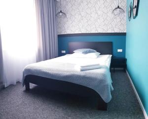 Posteľ alebo postele v izbe v ubytovaní Hotel Prowincja