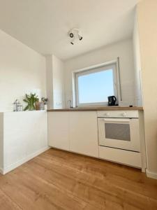 Kuchyň nebo kuchyňský kout v ubytování Apartment LoC Friedrichshafen