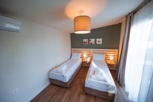 Postel nebo postele na pokoji v ubytování TERMAL KRE-SPA