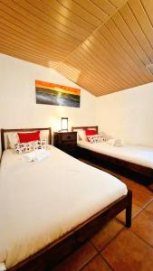 Postel nebo postele na pokoji v ubytování Casa em Nazare