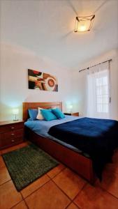 Postel nebo postele na pokoji v ubytování Casa em Nazare