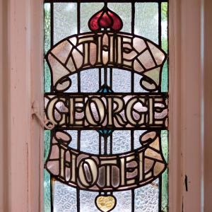 a stained glass window with the words forever home at The George & Heart House in Kent