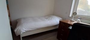 Ein Bett oder Betten in einem Zimmer der Unterkunft Hanover Fair Rooms