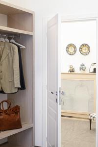 a walk in closet with a white door at la dimora di Cornelia in Sorrento