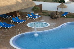 Bazén v ubytovaní Hostal Los Pinos alebo v jeho blízkosti