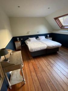 Een bed of bedden in een kamer bij Hotel In't Boldershof