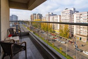 a balcony with a view of a city street at Lujerului Studio in Bucharest