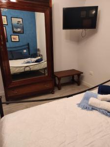 Кровать или кровати в номере Marolù Casa Vacanze