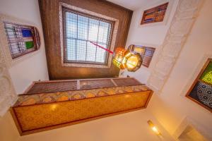 a room with a window with a light on it at Riad Fes Elite in Fès