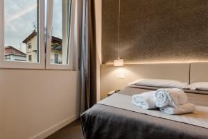 Posteľ alebo postele v izbe v ubytovaní Hotel Palazzo del Garda & Spa