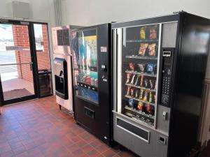 a large refrigerator with drinks in it in a room at Oquirrh Mountain Inn in Tooele
