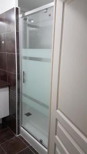 a glass shower door in a bathroom at Port Mezua in Mèze +42 photos