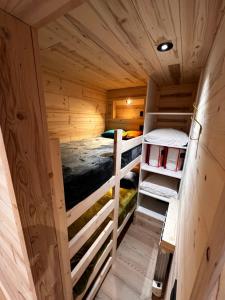 a small cabin with two bunk beds in it at Les appartements Makalu Val Thorens in Val Thorens