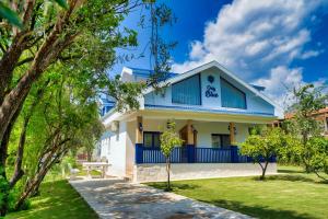 a white and blue house with a park at Only Blue Villa in Göcek