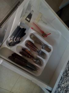 a drawer filled with utensils on a table at Lo de Chavela in Salta